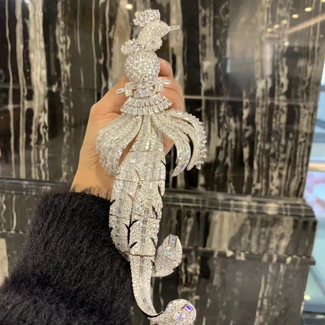 Silver bird brooch deals