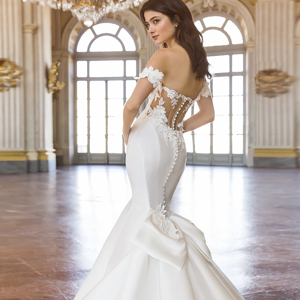 Abiti bohémien Boho personalizzati per le donne 2025 Abito lungo con spalle scoperte a sirena con applicazioni in raso bianco con fiocco e bottoni ritagliati