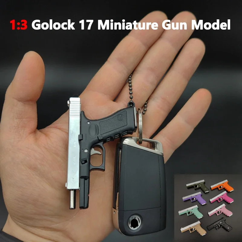 LLavero de juguete Fidget Glock 17 de varios colores, Mini pistola de Metal G17, carcasa portátil de eyección, montaje y desmontaje, con balas