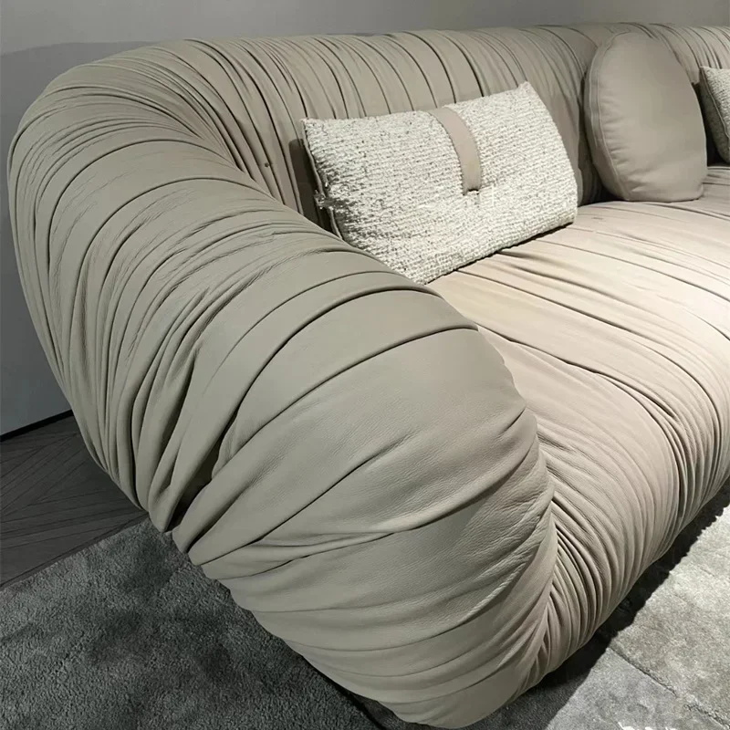 Wabi Stillwind pleated leather art sofa, Italian small apartment straight row sofa, designer French sofa arc retro