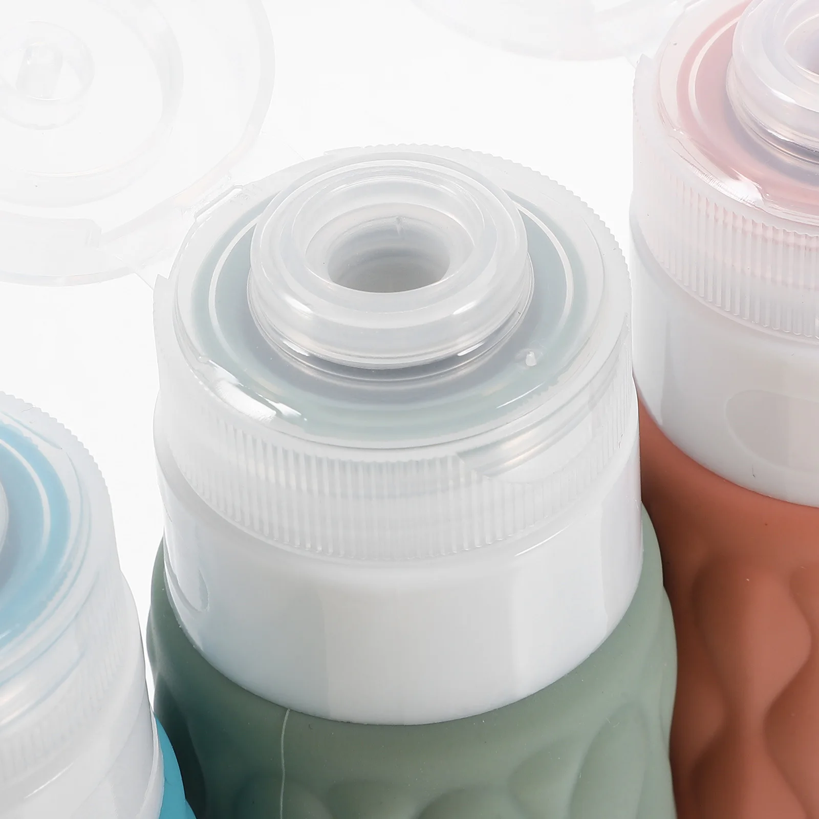 

4Pcs Travel Silicone Bottles Refillable Leakproof Containers for Shampoo Lotion Conditioner Travel Toiletries Bottles Set