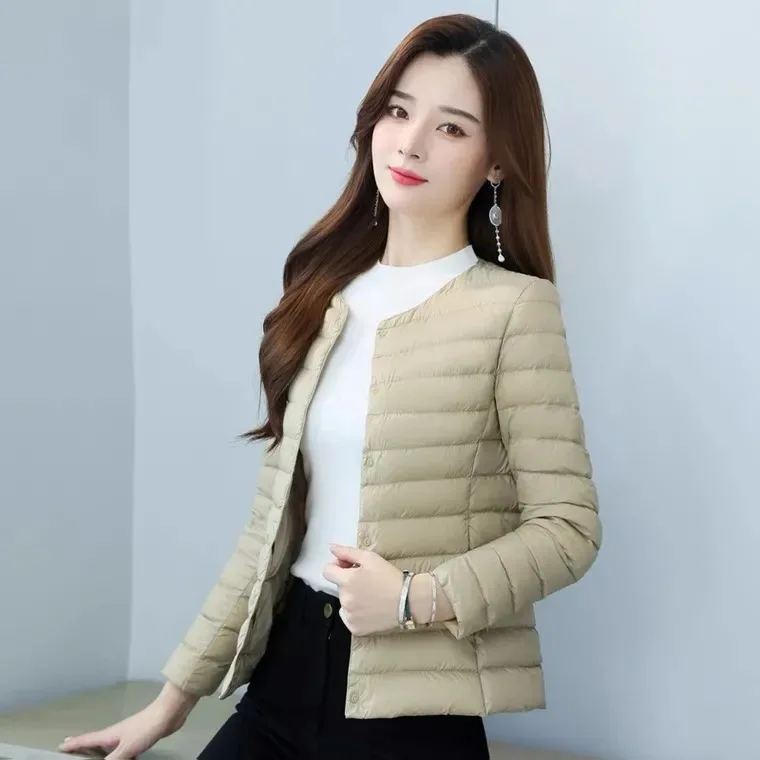 

Down and Cotton Jacket for Women Lightweight and Short with a Small Cotton Jacket for Warmth and a Collarless Inner Lining We