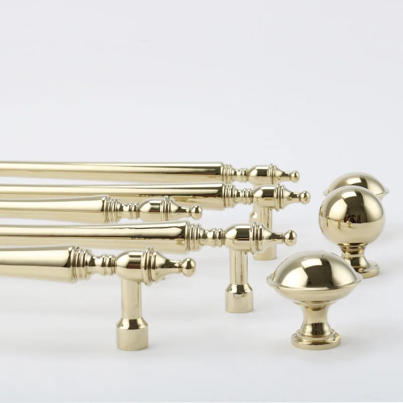 Close view of gold handle feet and knob profiles