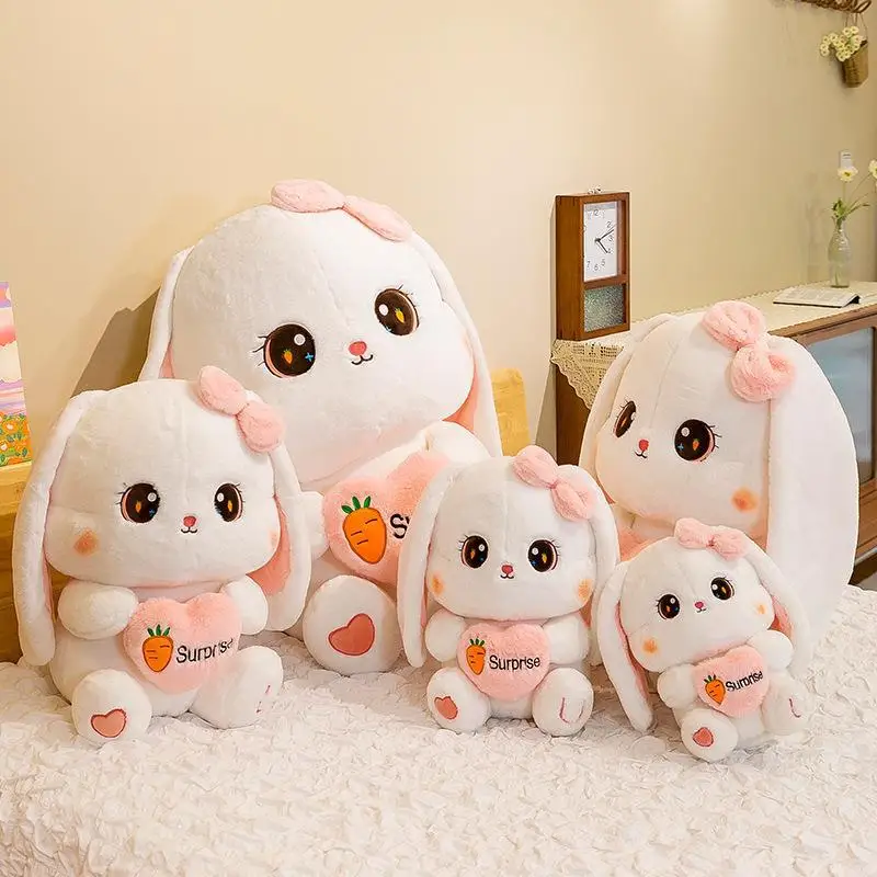 Simpatico coniglietto di peluche Kawaii, coniglietto di peluche che tiene una bambola con orecchie a cuore, regalo di compleanno per fabbrica di coppie di ragazzi e ragazze