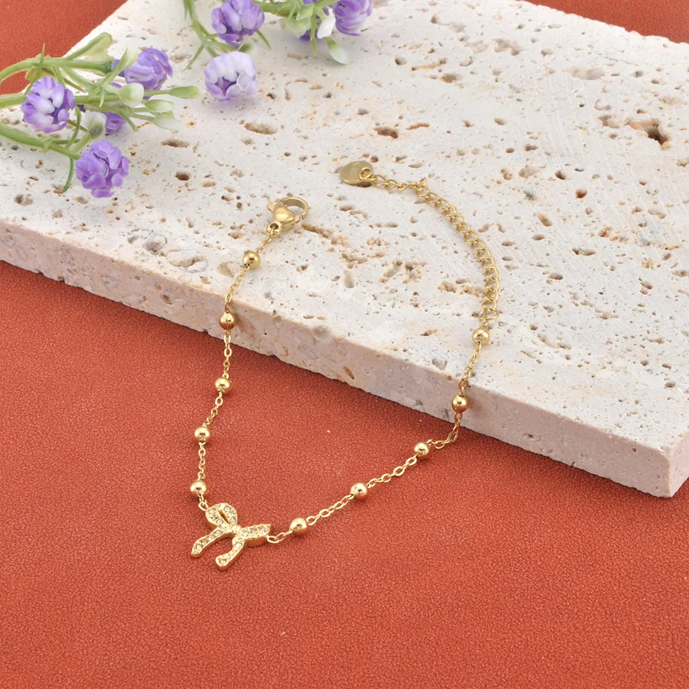 JeeMango Armband aus 316L-Edelstahl mit Zirkon-Schleifenanhänger für Damen und Mädchen, vergoldet, modisch, wasserdicht, Alltagsschmuck B25222