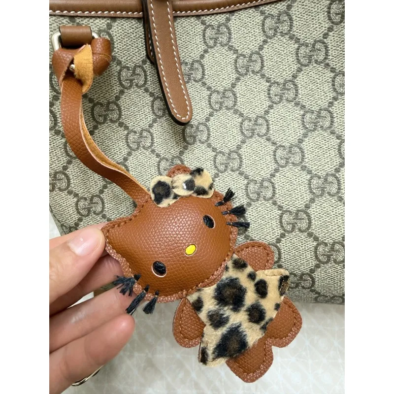 

New Sanrio Hello Kitty Cute Keychain Hanging Bag Hanging Decoration Leather Leopard Print Kt Pendant Clothing Decoration Gift