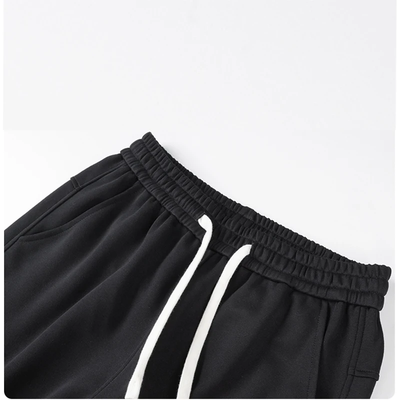 Męskie spodnie dresowe o prostym kroju, typu joggers, do sportu i streetwearu, luźne, oversize'owe, z długimi nogawkami, ze sznurkiem, męskie spodnie z wieloma kieszeniami.