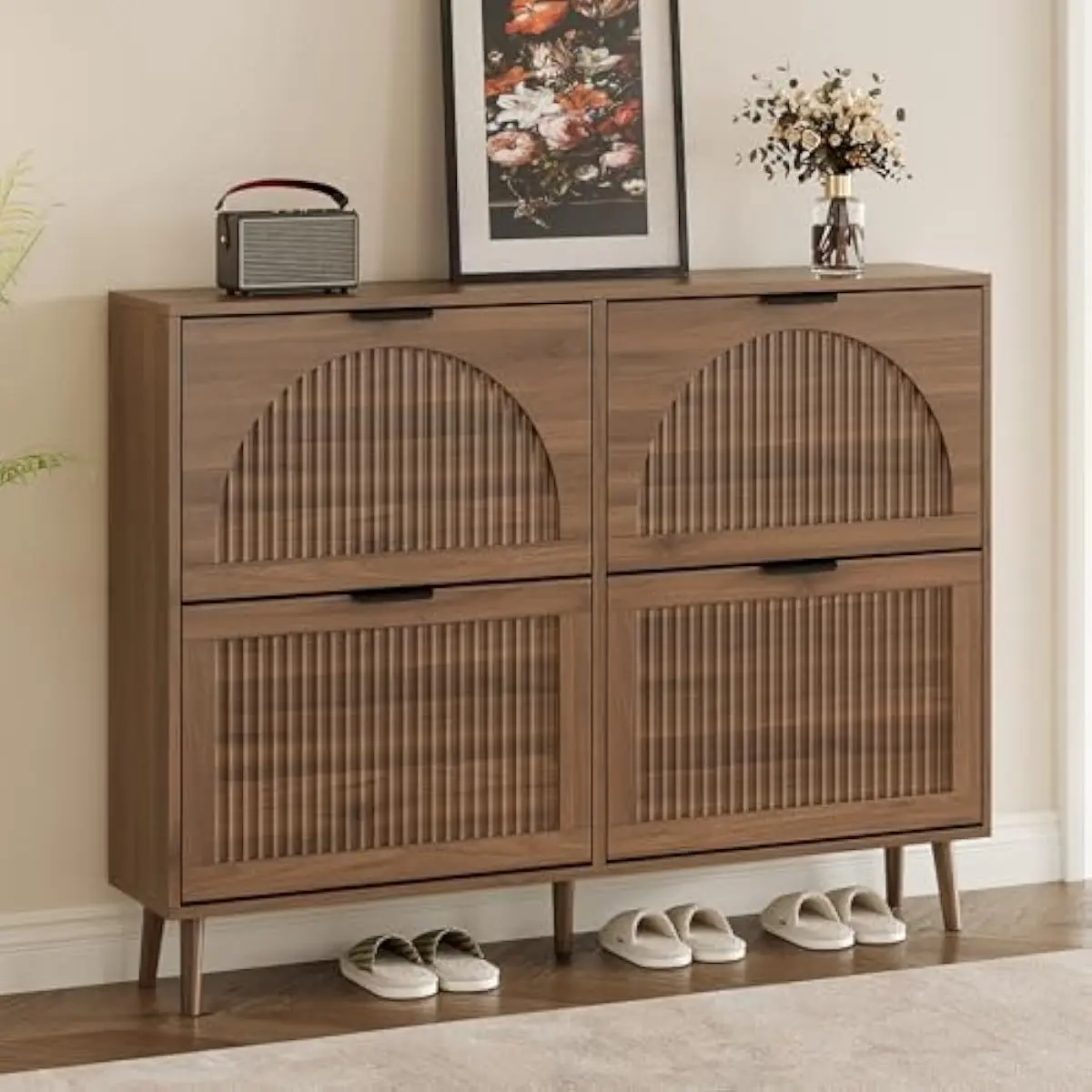 Slim shoe storage unit featuring four smooth flip drawers and elegant vertical groove detailing on natural wood finish. Compact