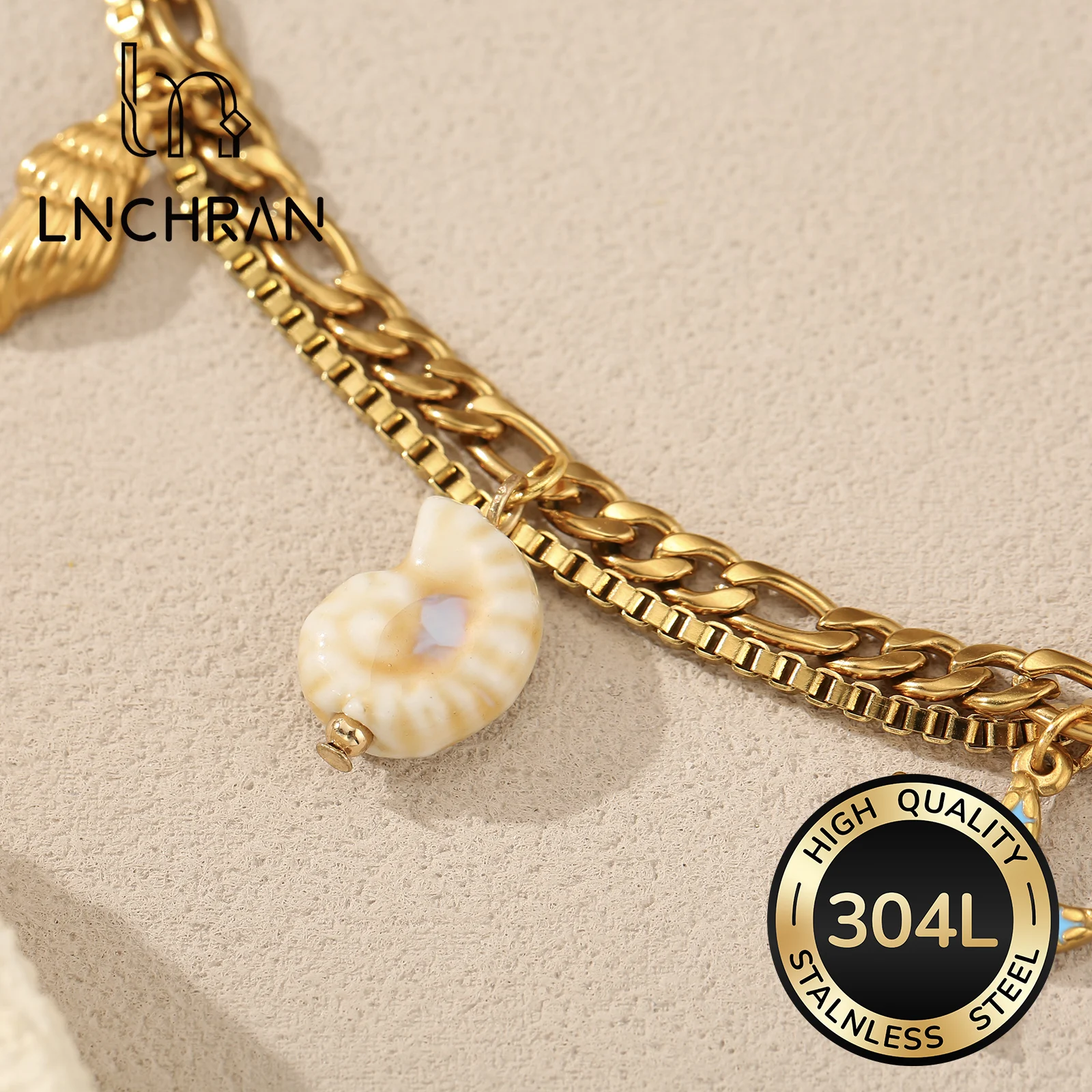 Golden Tone Stainless Steel Ocean Charm Bracelet with Dolphin Starfish and Shell Pendants for Women