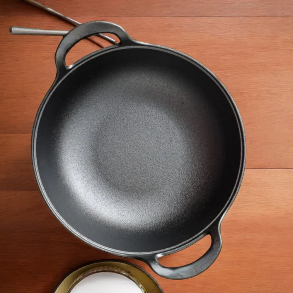 High-quality, versatile cast iron wok pan - perfect for searing, baking, stir-frying, and kitchen cooking. Durable and ideal for