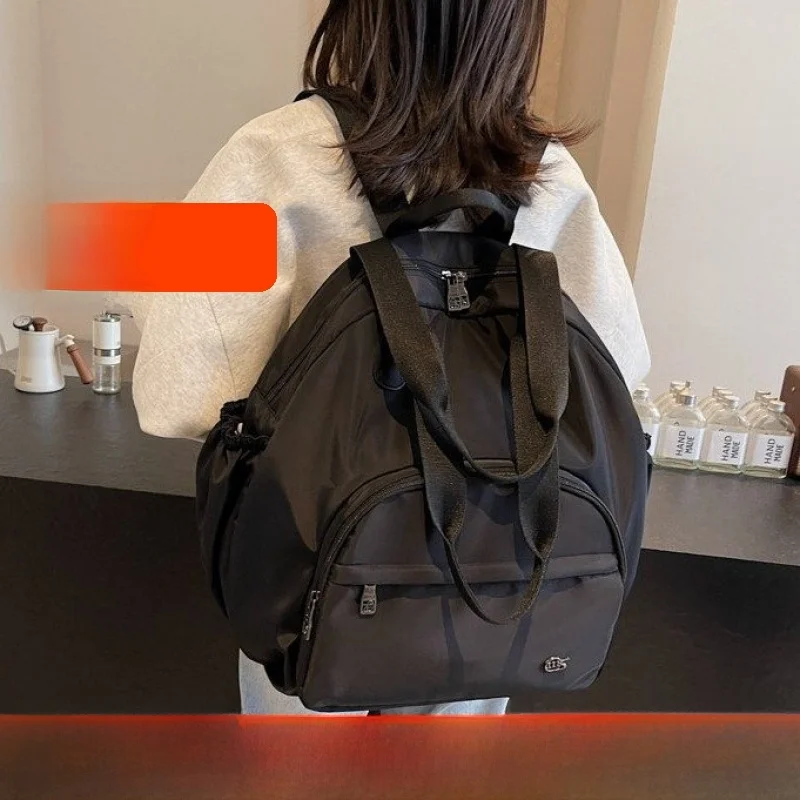 

2026 New Casual Faion Lightweight Luxury Commuter Student Bapa Double oulder Bag Leisure Trend Youth Nylon Waterproof