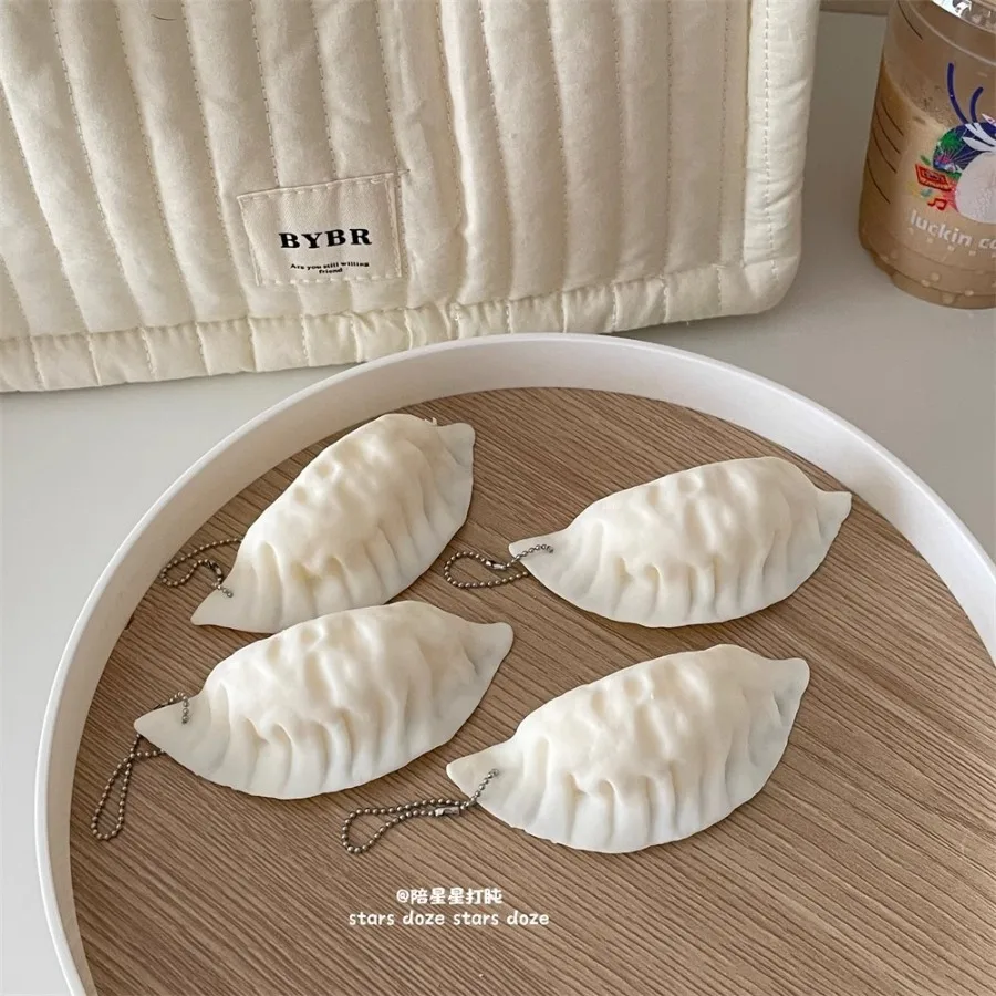 Creative and cute imitation dumplings soft pinching music venting decompression toys props students fun gifts hanging pendant