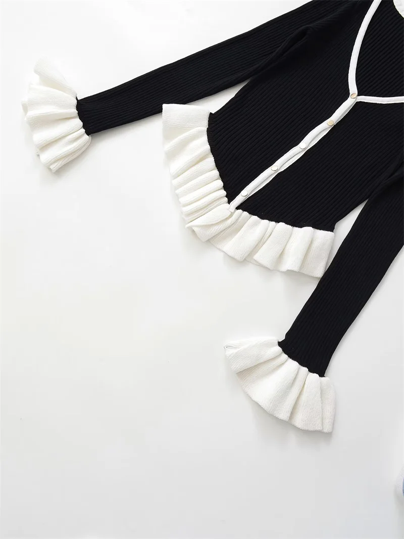 Nieuwe damesjas herfststijl zwart en wit kleurblok lange mouw V-hals gebreid vest jas stijlvol en sexy
