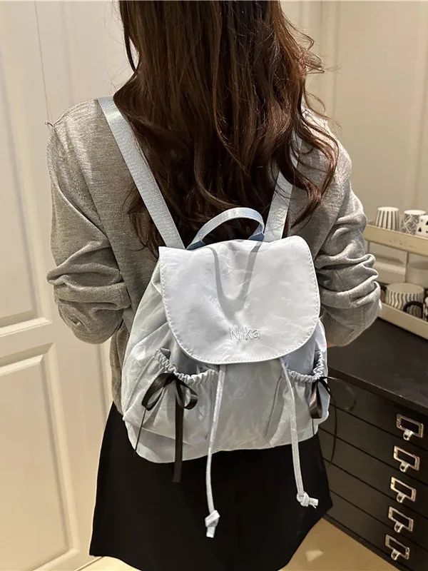 Casual Canvas  Knot Women's Backpack Summer 2026 New Simple Travel Bag Commuter Style Flip Cover Soft Bucket Shape