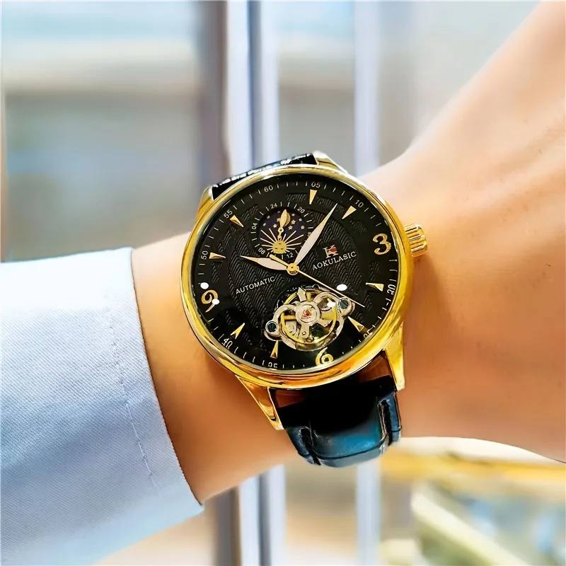 ساعة رجالية راقية بنمط عمل فاخر، تتميز بمينا هيكل عظمي، وهيكل معدني دائري، وحركة ميكانيكية أوتوماتيكية، وحزام جلدي، بدون بطارية، مثالية لعيد الحب، والكرنفال، وعيد الميلاد