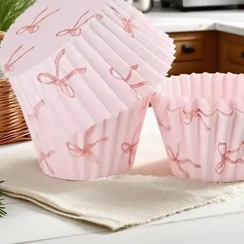 100 Uds. Tazas para hornear de papel con lazo rosa, envoltorios para magdalenas, adornos para magdalenas con lazo, selecciones de postre, decoraciones para fiesta de cumpleaños, boda, Baby Shower