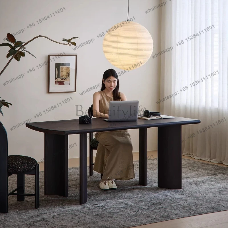 

Nordic solid wood dining table rectangular retro black designer small apartment wabi sand wind dining table