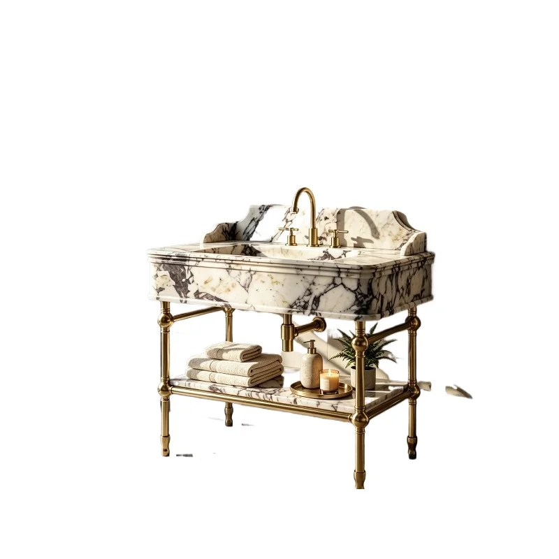 Modern rectangular and oval bathroom sinks made of natural marble, with brass bases and drains