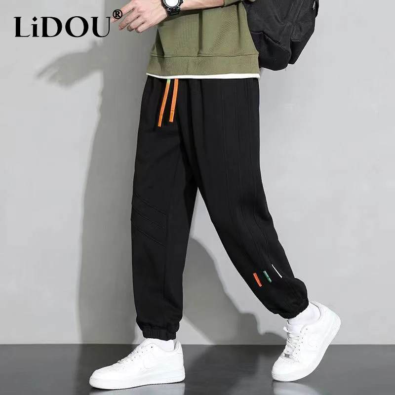 

2023 Spring Autumn New Solid Color Elastic Waist Drawstring Pockets Pencil Pants Man All-match Comfortable Street Motion Trouser