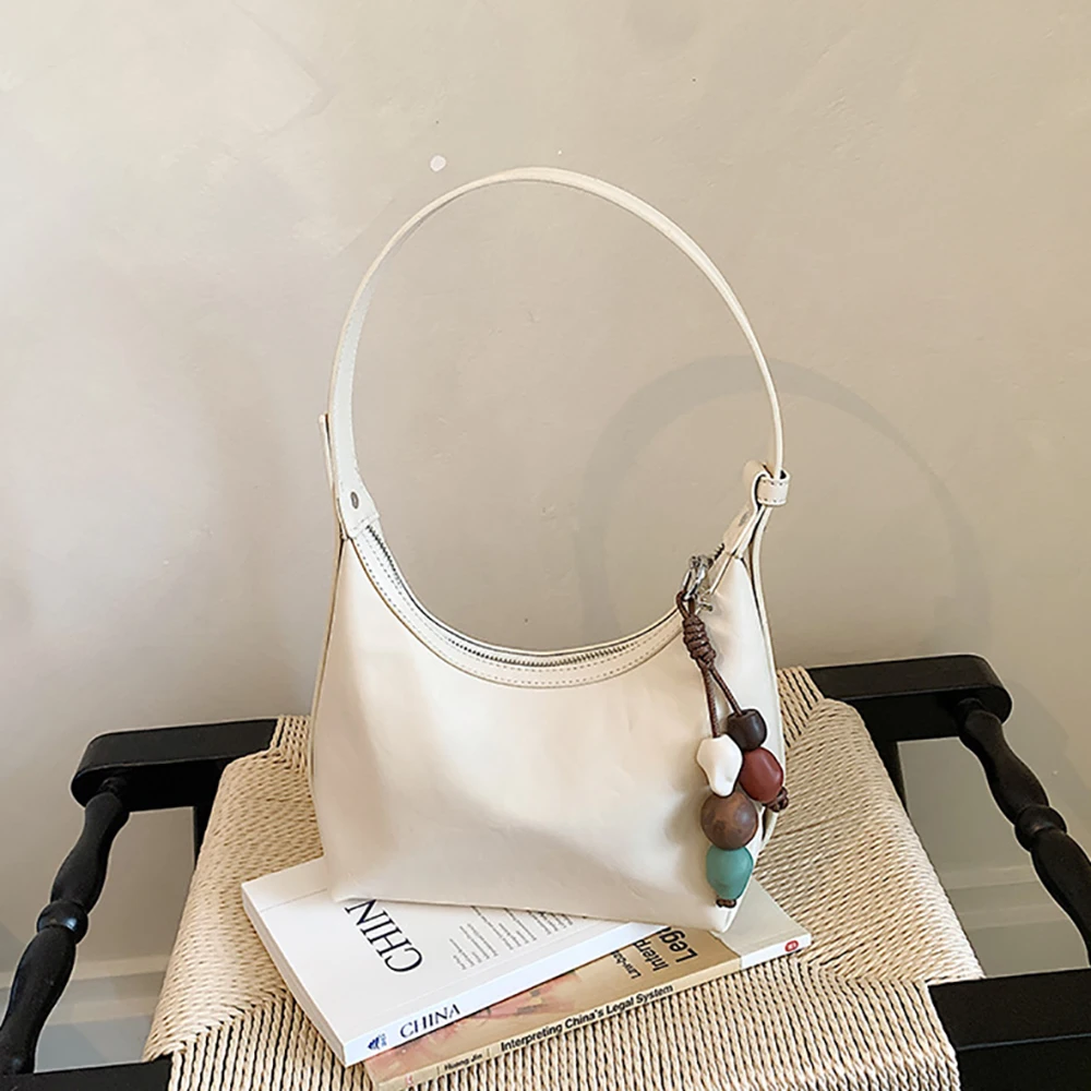 

2026 Chic New Solid Color Shoulder Bag Women's Delicate PU Leather All-Match Armpit Handbags Daily Versatile Messenger Bags