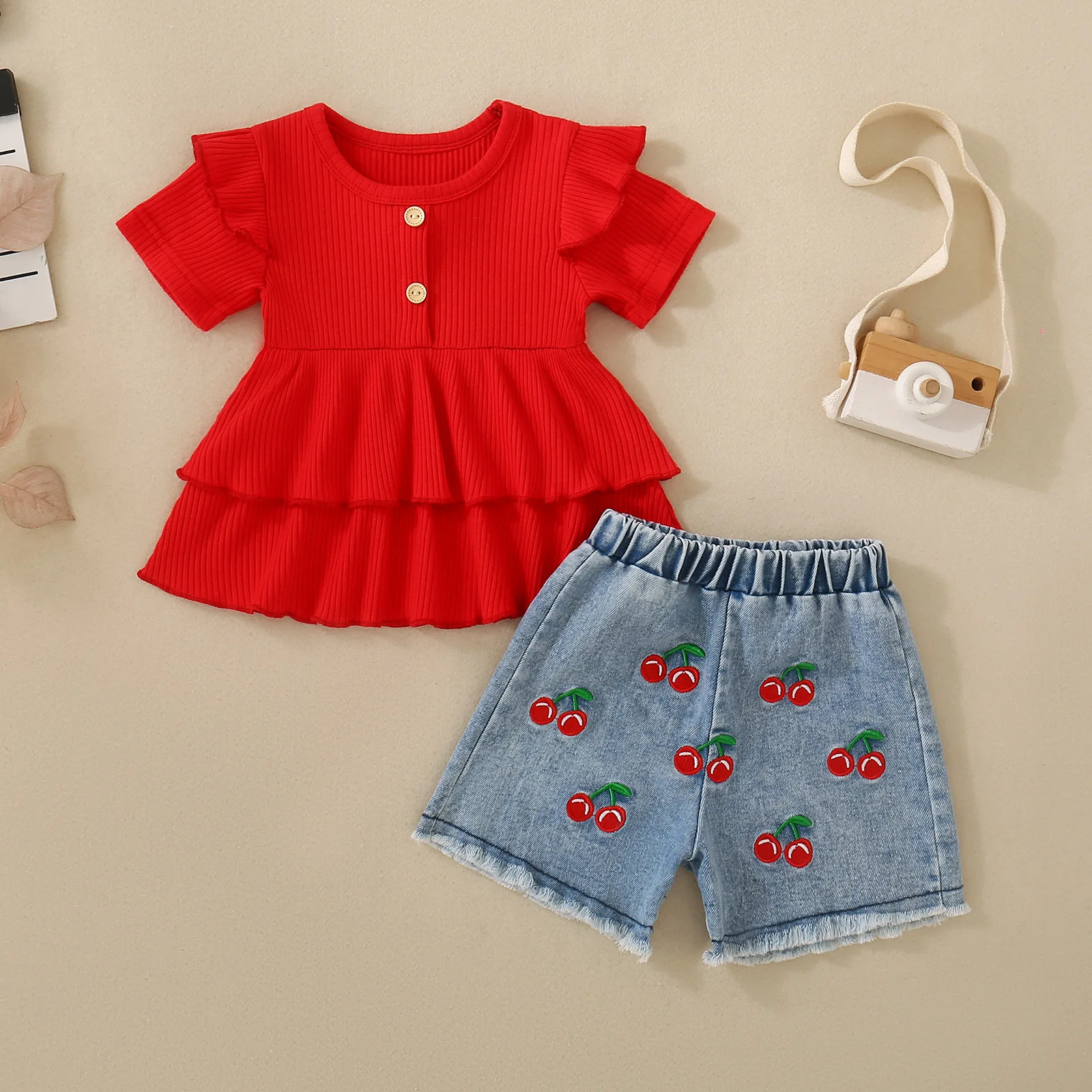 Two pieces of red ruffle-trimmed short-sleeved top and cherry denim shorts for baby girls and soft pit strips in summer