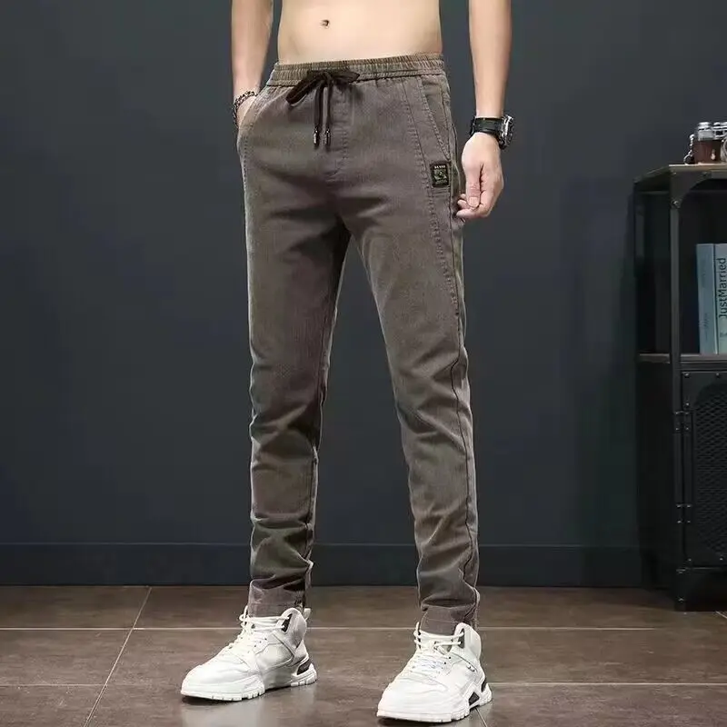 Fashion Elastic Pockets Spliced Denim Casual Pants Men's Clothing 2024 Summer New Loose Korean Solid Color High Waist Trousers