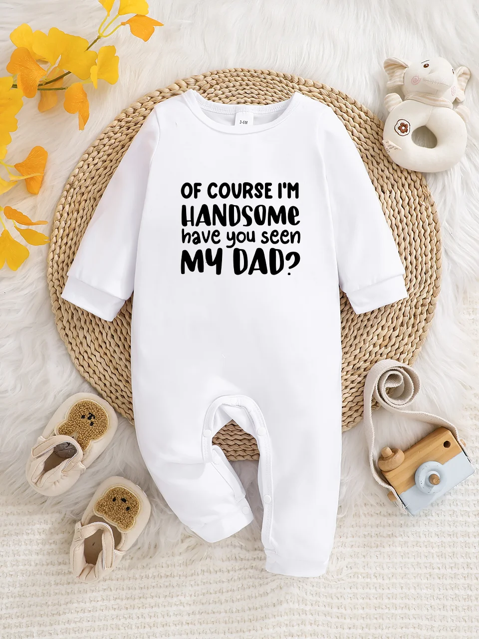 Baby long-sleeved bodysuit with fun letter prints, button design, easy care, suitable for new parents.