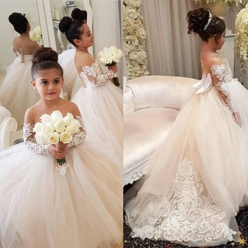 BABYONLINE حار بيع فساتين فتاة زهرة الدانتيل |   أكمام طويلة شفافة، فيونكة كبيرة وتنورة تول فاخرة لحفلات الزفاف