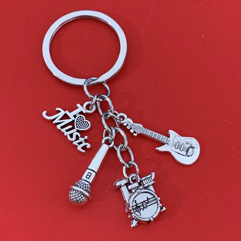

Men's antique silver music cassette guitar microphone classic music alloy keychain, backpack pendant decoration