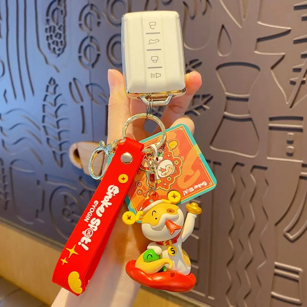 

Kawaii Festive Snake Year Keychain Puppy Blessing Cartoon Snake Keychain Gold Coins PVC New Year Key Ring Gifts