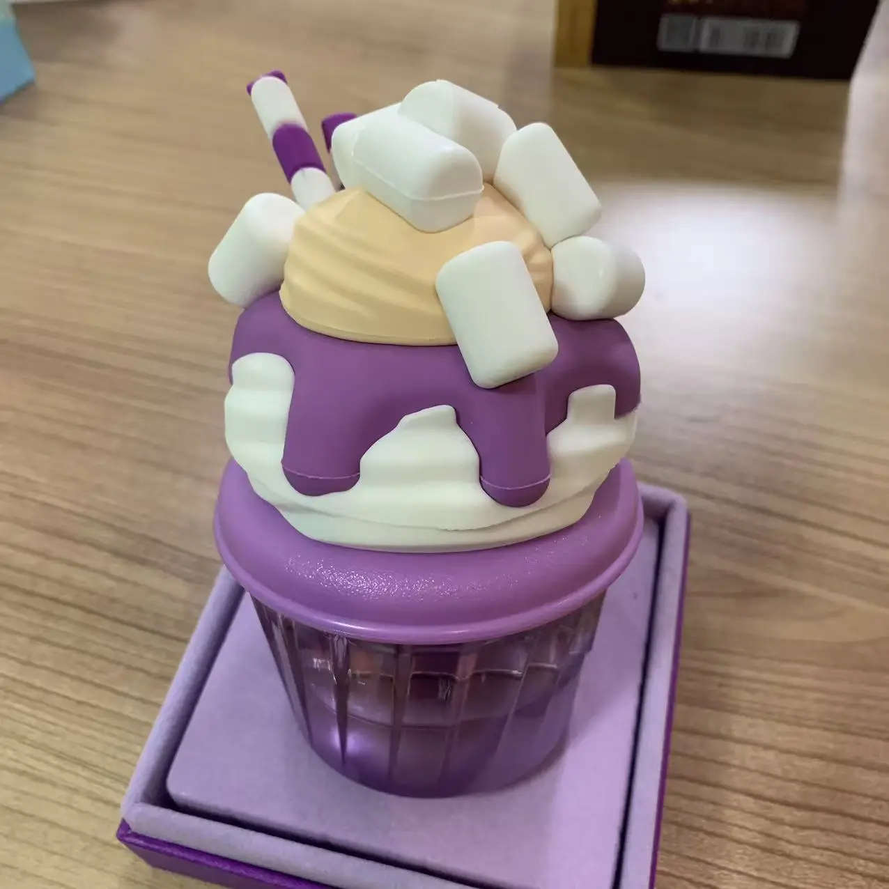 

La 'ttafa Mal' low Madn'ess (75ml) has a fruity and sweet aroma. The bottle is shaped like a purple ice cream cupperfect gift