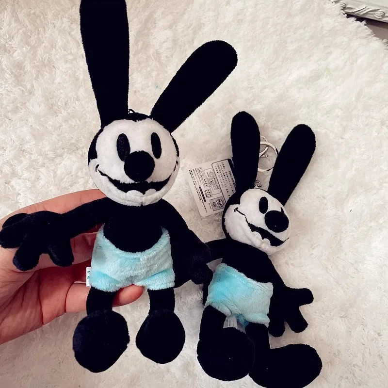 Oswald จี้ตุ๊กตากระต่ายนำโชคพวงกุญแจน่ารักกระเป๋าเป้สะพายหลังตกแต่งการ์ตูนอุปกรณ์ต่อพ่วงตุ๊กตาเพื่อนของขวัญวันคริสต์มาส