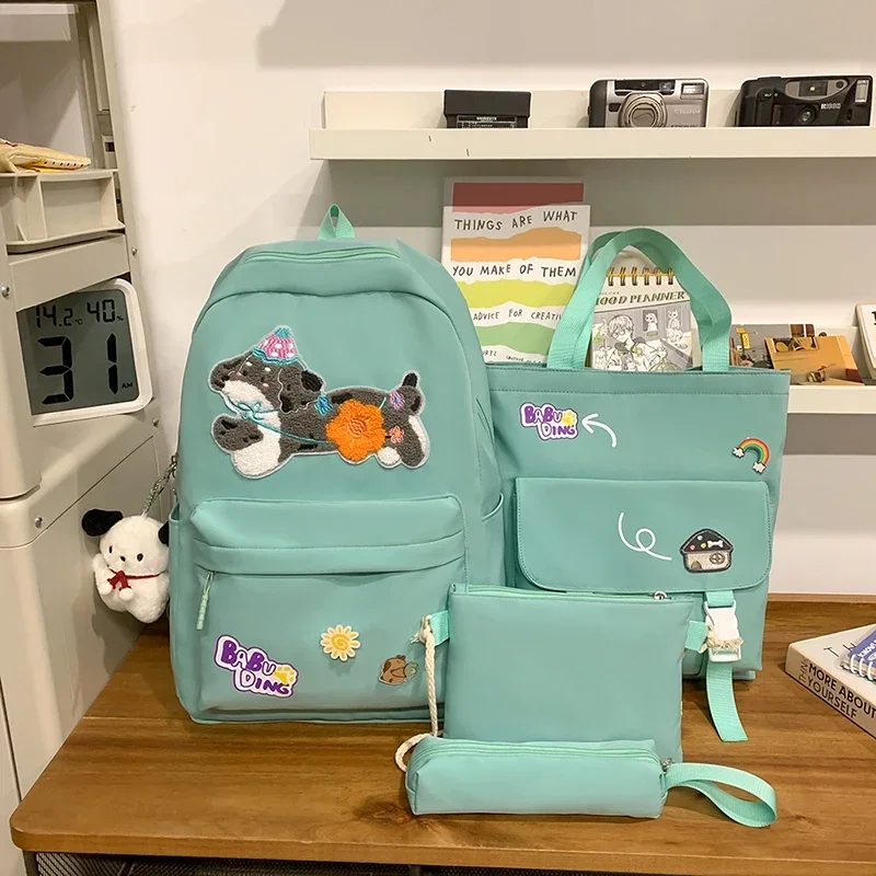 

Four Piece Backpack Set for Women 2025 New Junior High School Student Backpack, Large Capacity, Cute and Versatile Backpack Sac