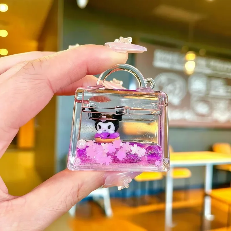Sanrio Kawaii caja ciega púrpura Kulomi TV muñeca acrílico botella a la deriva Mini adornos de arena movediza llavero bolsa colgante al por mayor