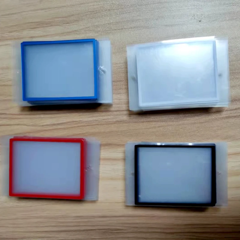 สีสันโปร่งใสพื้นผิวกระจกพลาสติกเลนส์ป้องกันสำหรับ NintendDSi สีดำสีขาวสีแดงสีฟ้ากรอบ