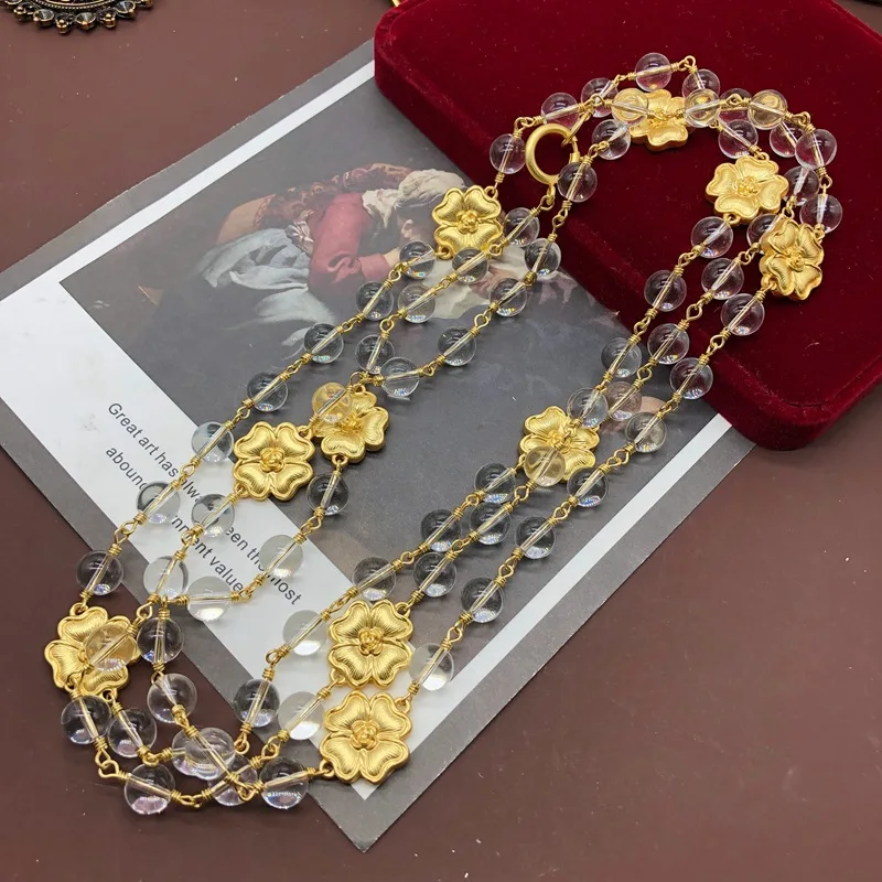 

2023 Medieval court plated real gold matte four-leaf clover modeling transparent glass bead heavy industry long necklace sweater