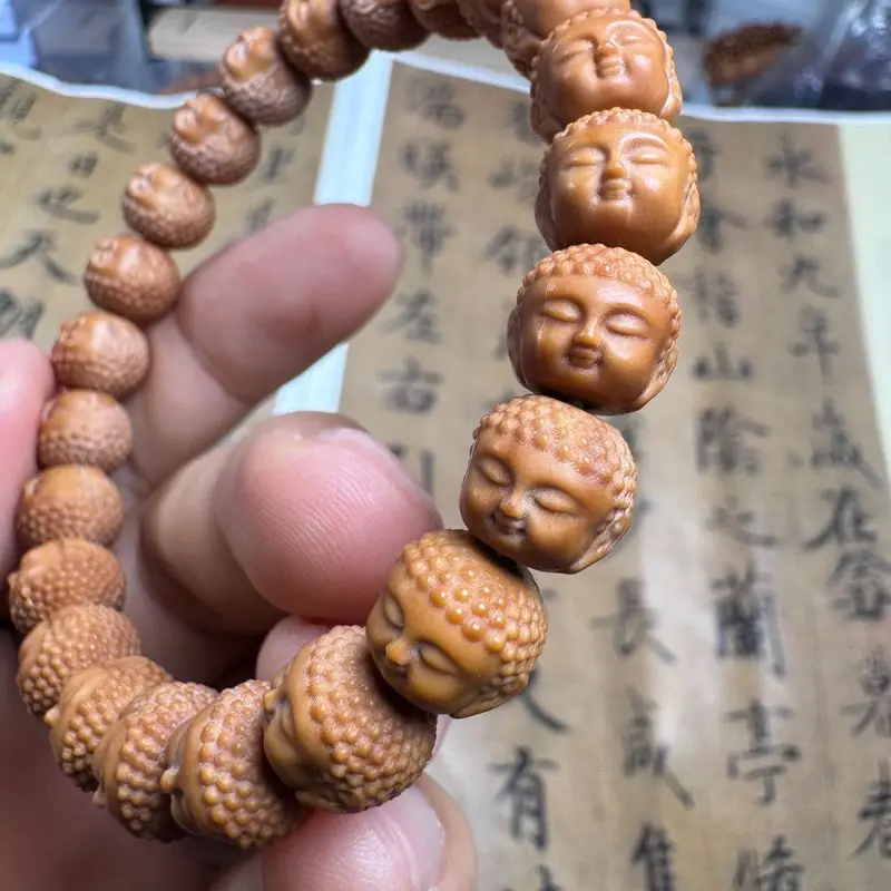 A-grade complete set of carvings baby Buddha monkey head walnut bracelet Beijing-style eight-sided peach