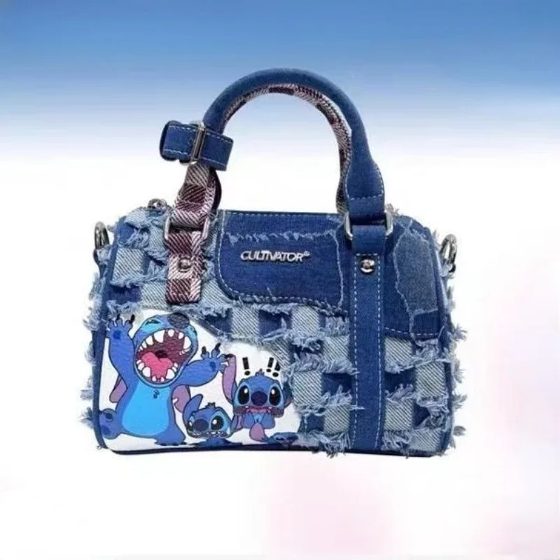 Stitch women\'s new fashion versatile personality creative cartoon pattern large capacity storage denim hole stitching handbag