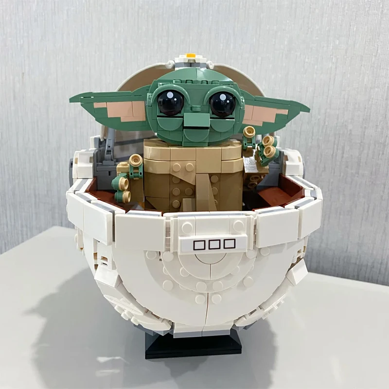 

1048PCS In Stock Cartoon Series Grogu with Hover Pram Model Building Blocks Ancient Set Assembled Bricks Toys Gift For Kid Adult