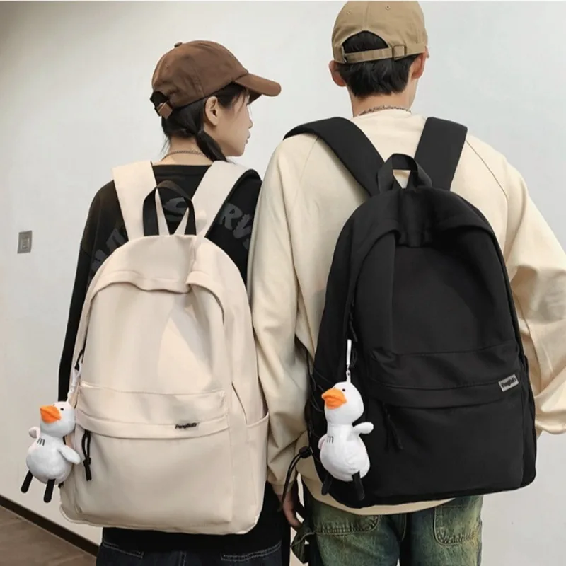 Minimalist School Commuter Backpack with Detachable Duck Plush Keychain Multi Pocket Lightweight Rucksack for Students Travel