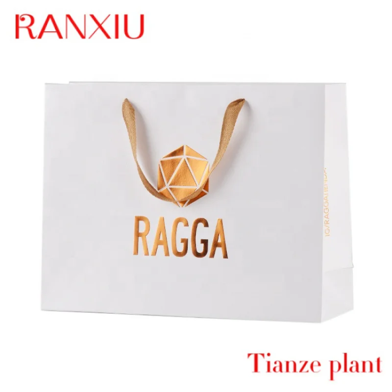 Bolsa de compras de papel de regalo de color de lujo personalizada con su propio logotipo, bolsas de papel kraft negras con asa