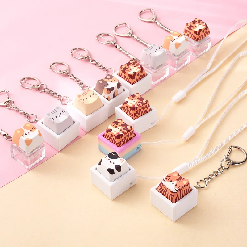 Creative stress relieving keycaps for cats and dogs, button pinching and music for keychains, small pendants for stress relief