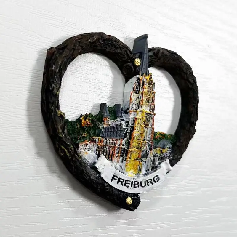 Tourist souvenir magnetic fridge magnet from main church of Monastery in Freiburg, capital of German Black Fores