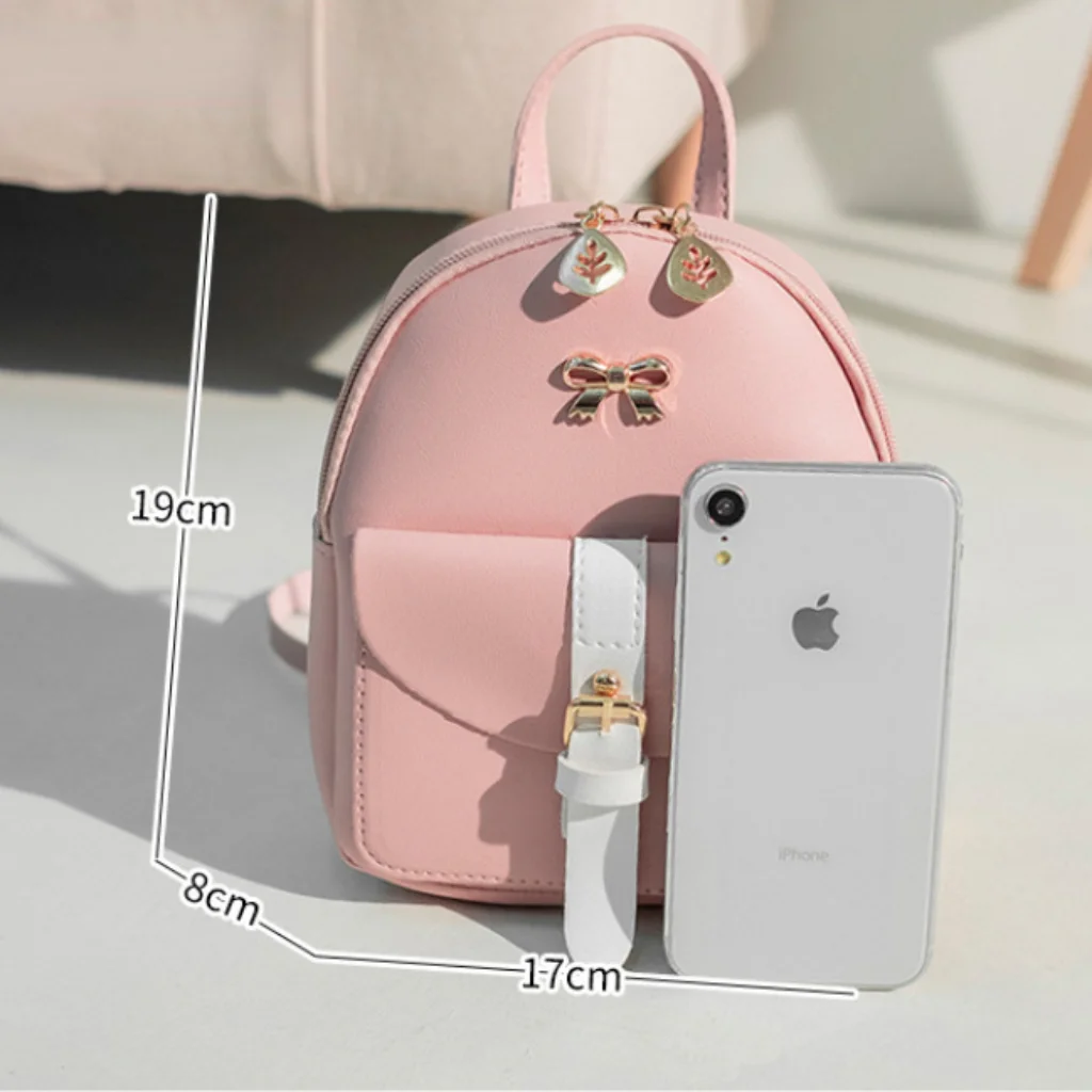 Mini mochila de piel sintética para mujer, bolso con cremallera de hoja hueca con logotipo de lazo, mochila Kawaii para niña, bolso escolar pequeño