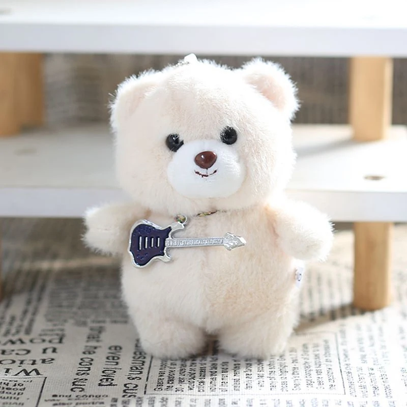 Poupée en peluche avec pendentif ours en peluche de guitare douce - Porte-clés en peluche mignon pour sac à dos - Cadeau d'anniversaire idéal pour enfant.