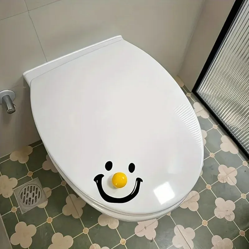 Elevador de tapa de inodoro con bola de sonrisa de dopamina de estilo contemporáneo, forma redonda, abridor de tapa de asiento de inodoro de mano para Baño