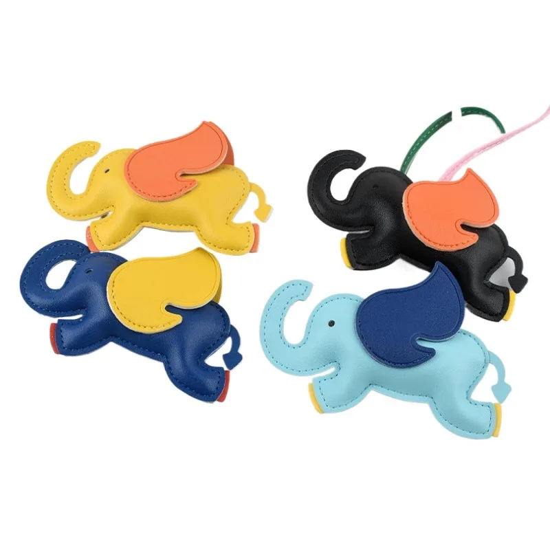 พวงกุญแจหนังรูปช้างมาสคอตห้อยกระเป๋าดีไซเนอร์ พวงกุญแจรถยนต์สุดสร้างสรรค์ ช้างน้อยน่ารักบินได้ ของขวัญคริสต์มาส จี้ห้อยกระเป๋า