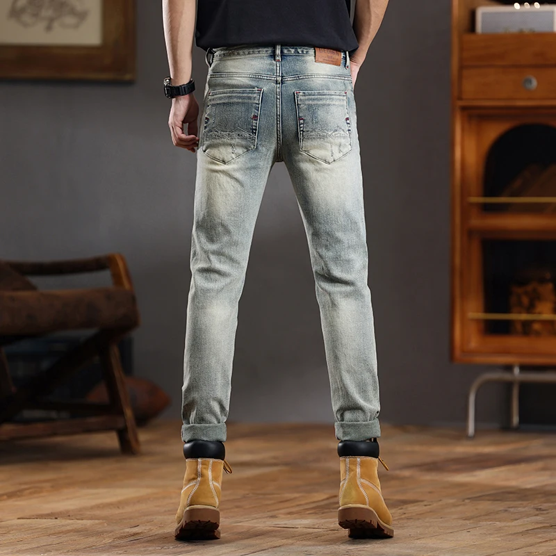 European and American retro distressed jeans men's fashionable slim fit small feet ripped casual pants skinny jeans men