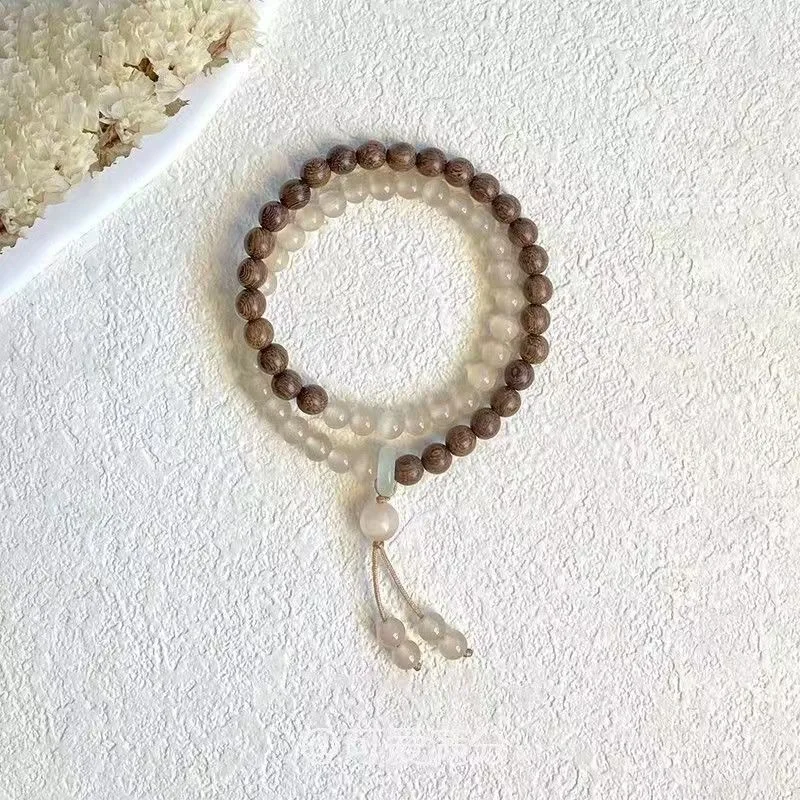 

Новый китайский ретро-браслет из древесины куриных крыльев с двойным кругом, высококачественное украшение для женщин, цвета сине-голубого льда.