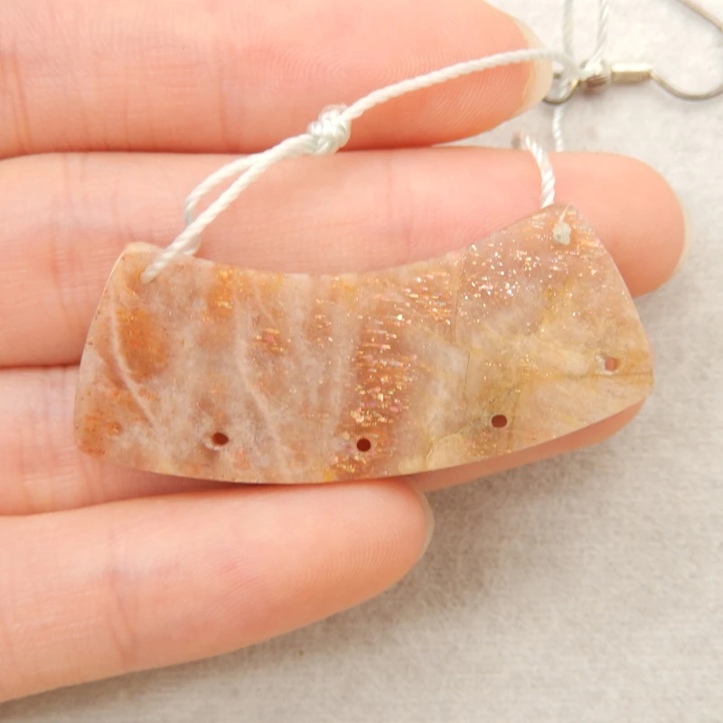 

Polished Sunstone Curved Connector – Natural Orange Gemstone with Sparkling Inclusions for Artisanal Jewelry Making